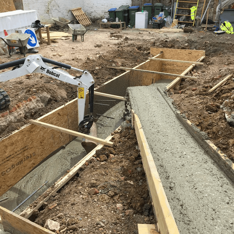 pouring the foundations for a new house by groundworks contractors London